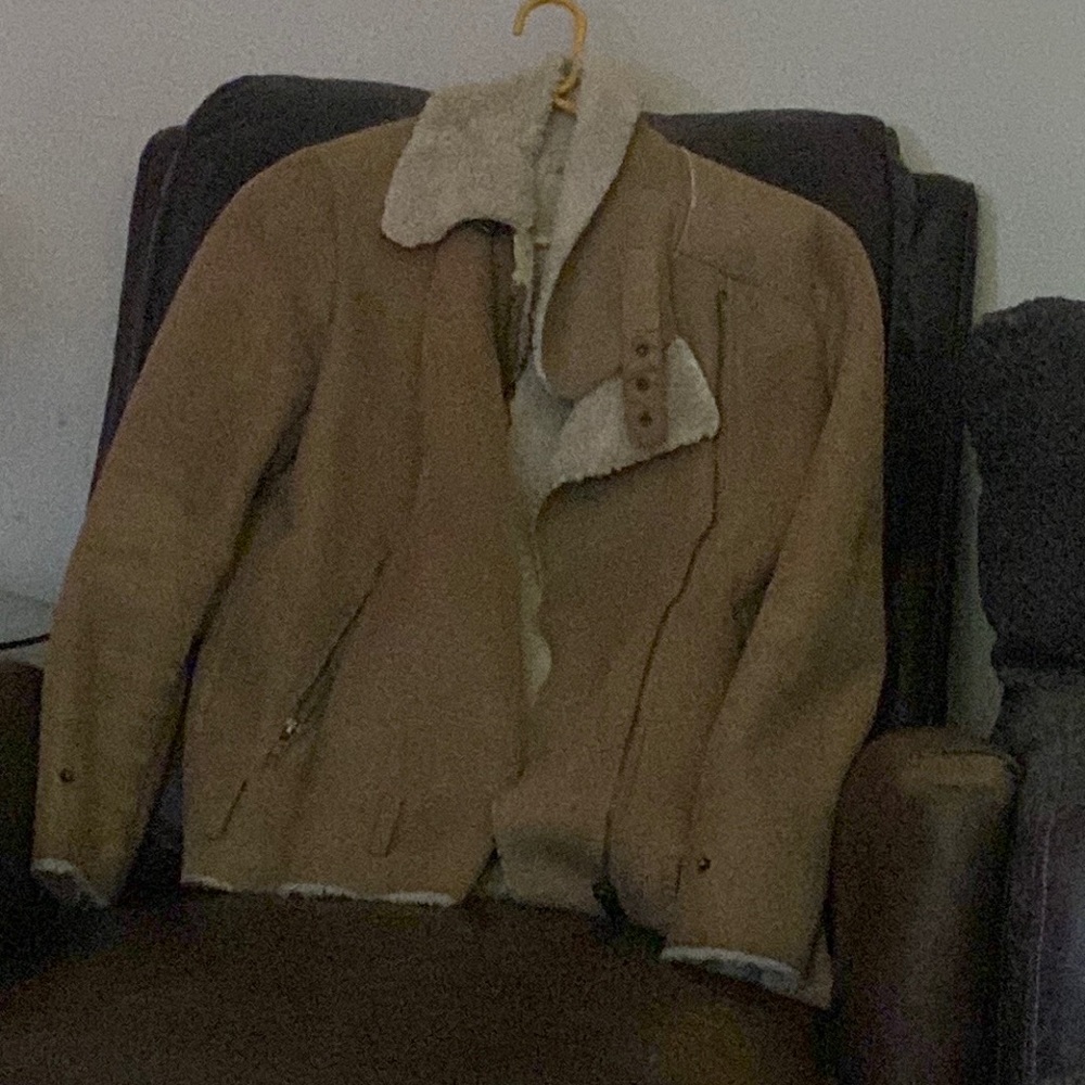 Coat with a white fur-like interior to keep you cozy during the fall months.